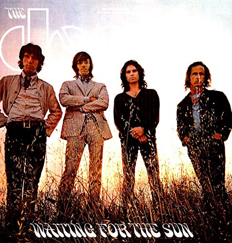The Doors band members stand in a field on the album cover.