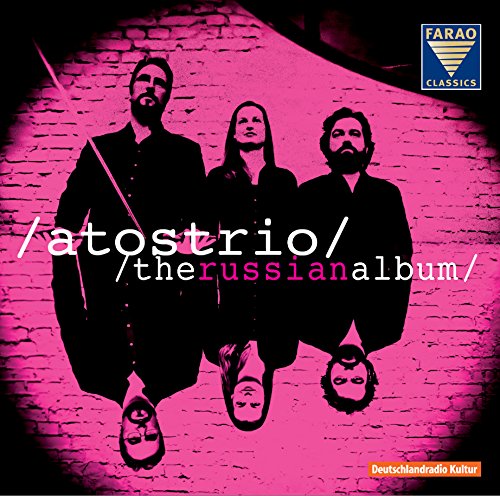 CD album cover with three men standing against a brick wall, tinted pink.