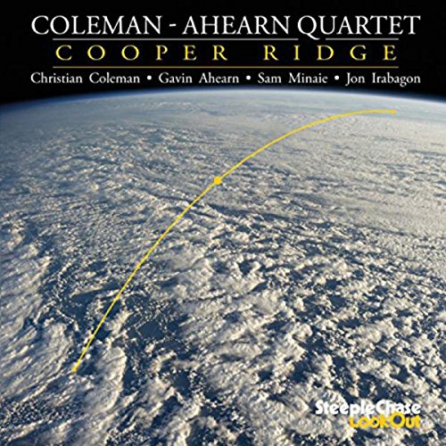 "CD cover with aerial view of earth and curved yellow line."