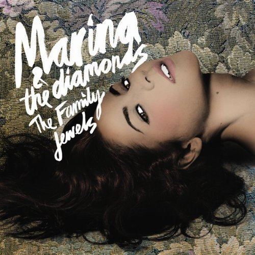"Album cover with a woman lying on a patterned fabric, looking upwards."