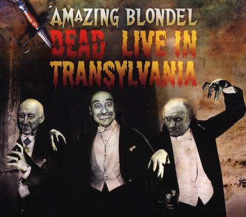 "CD cover art featuring three undead men in tuxedos with title 'Dead Live In Transylvania'."