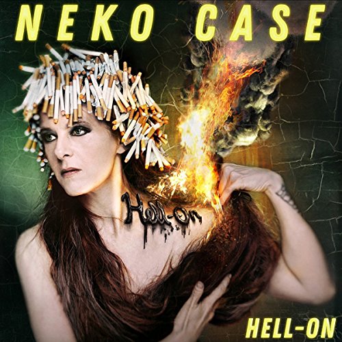 Neko Case album cover: woman with cigarette headpiece, flaming hair, dark background.