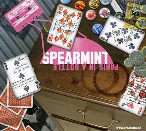 Album cover for "Paris In A Bottle" by Spearmint, featuring a wooden trunk and playing cards.