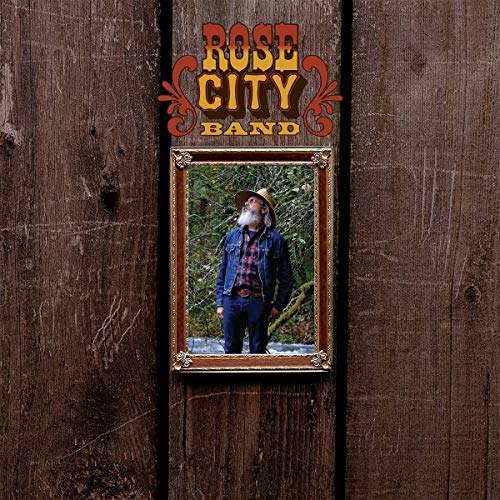 Vinyl record cover: "Rose City Band - Earth Trip" with framed portrait.