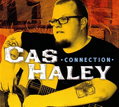 Album cover with a man holding a guitar, text "Cas Haley Connection".