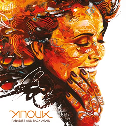 Close-up portrait of Anouk with vibrant, swirling orange and black artwork.