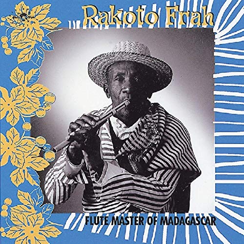 CD cover featuring a man playing a flute, wearing a hat, with floral design.