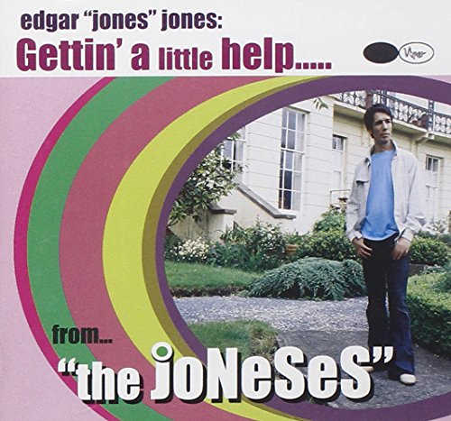 Album cover featuring a man standing in front of a house, colorful circles.