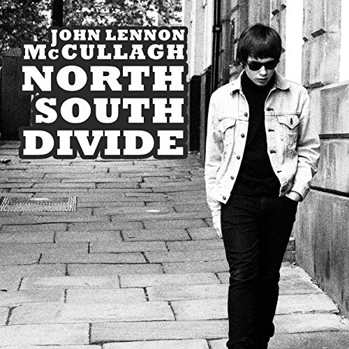 "Black and white CD cover featuring a man walking down a brick alleyway."