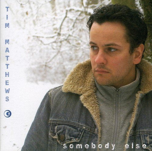 Album cover: man in denim jacket with fur collar in snowy scene.
