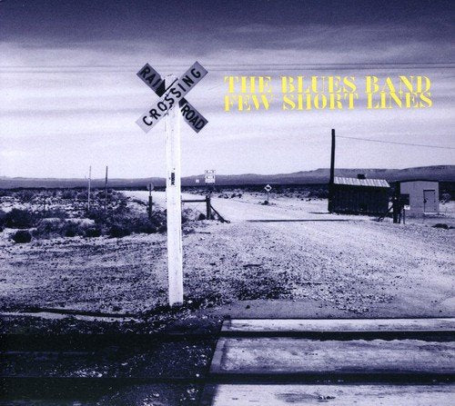 "Album cover featuring a monochrome railroad crossing sign with yellow text: 'The Blues Band Few Short Lines'."