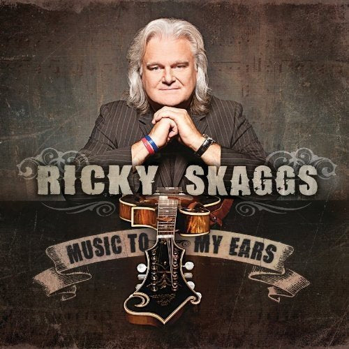 Album cover featuring Ricky Skaggs with guitars and ornate text on a dark background.