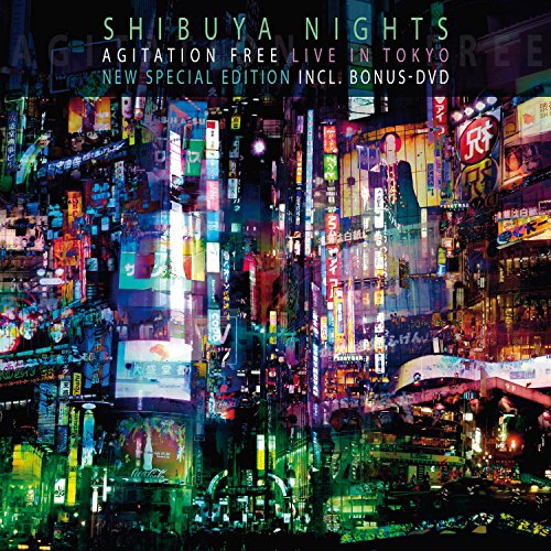 "Album cover featuring a vibrant, neon-lit Tokyo cityscape at night with text overlay."