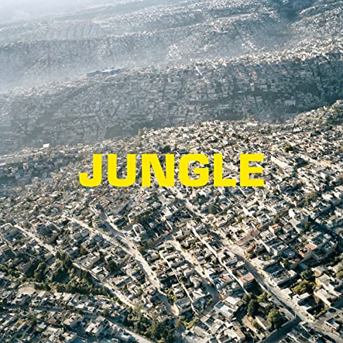 Aerial view of a dense, sprawling cityscape with the word "JUNGLE".