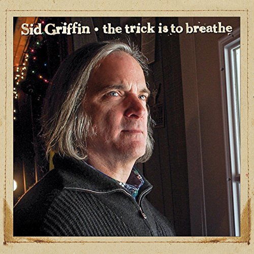 "CD cover featuring a man with gray hair, wearing a dark sweater indoors."