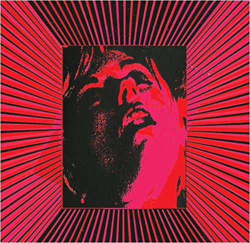 CD cover: man’s face in red and black with radiating lines.