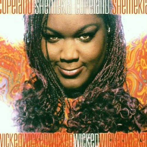Shemekia Copeland's album cover featuring her portrait with braids and a patterned background.