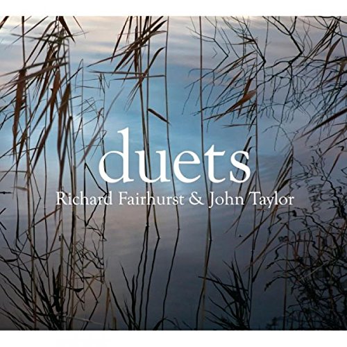 "CD cover with 'duets' in white text, surrounded by reeds and a body of water."