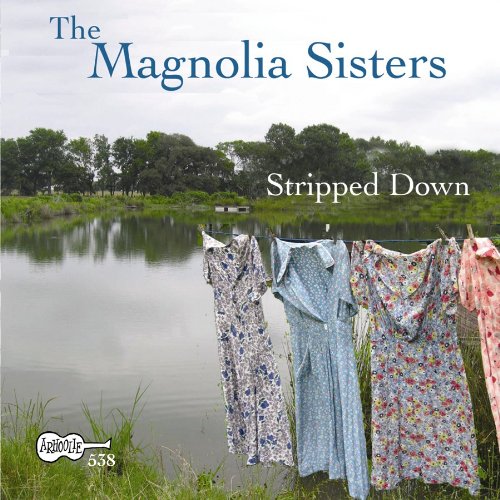 The image shows a CD cover with dresses hanging on a line by a lake.