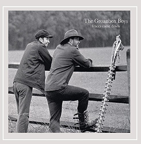 Black and white album cover with two men leaning on a broken fence.