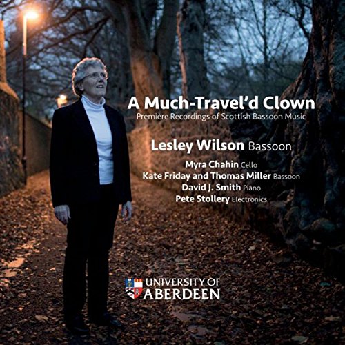 CD cover featuring a woman in black standing in a wooded area at dusk.