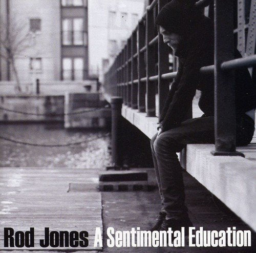 "CD cover with a man leaning on a bridge railing, sepia-toned image."