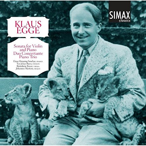 Black and white CD cover with a man holding lion cubs and text overlay.