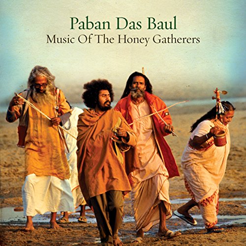 "CD cover featuring four musicians walking on a beach, holding traditional instruments."