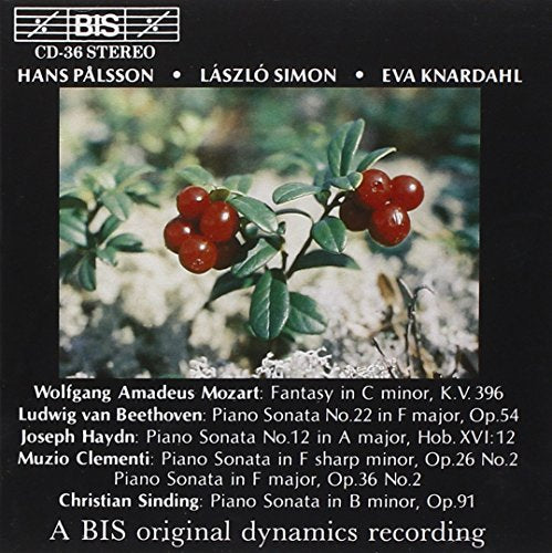"CD cover with red berries on a branch, surrounded by white text on a black background."
