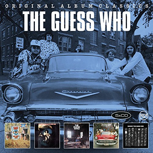 The Guess Who band members pose behind a vintage Chevrolet, with five album covers below.