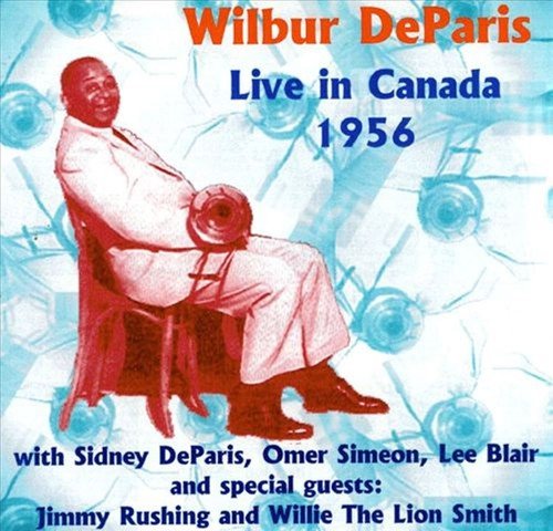 Album cover with a man sitting on a chair holding a trumpet.