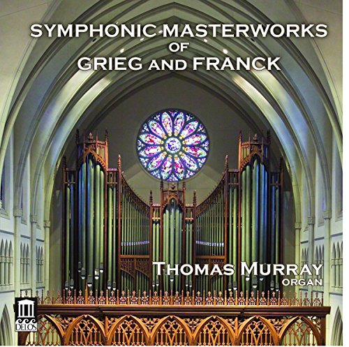 "CD cover featuring a church organ and stained glass window, with white text."