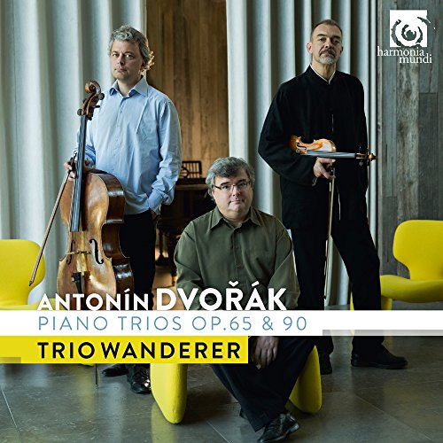 "CD cover featuring three men, one seated and two standing with musical instruments."