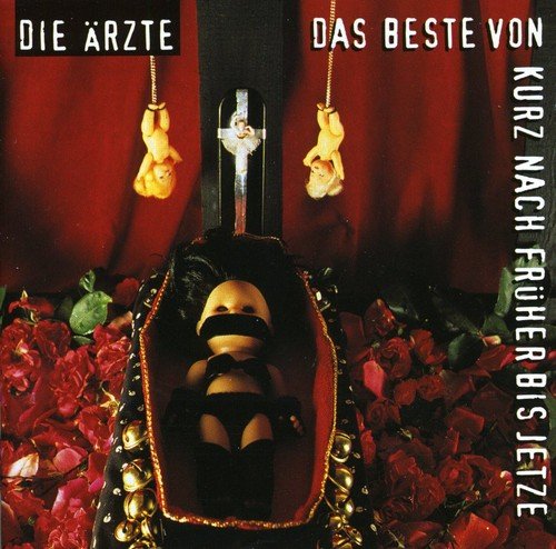 CD cover with dolls, roses, and a dark, theatrical aesthetic.
