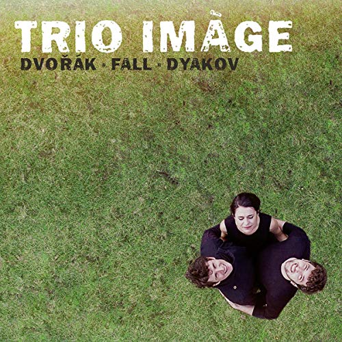 CD cover with three people embracing on a green grass background.