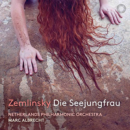 CD cover: hands reaching toward flowing red hair on stone.