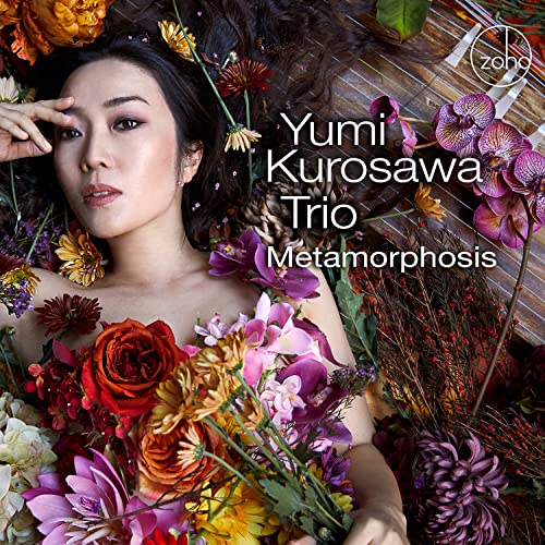 CD cover featuring Yumi Kurosawa surrounded by colorful flowers.