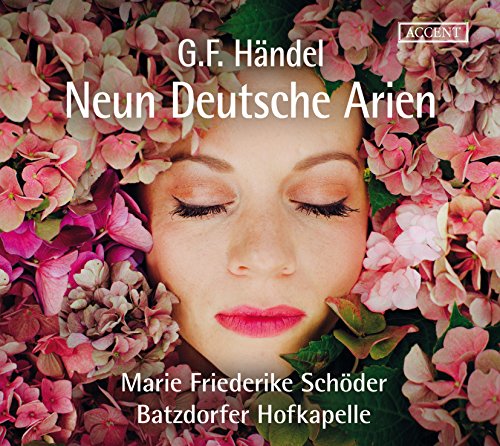 "CD cover featuring a woman's face surrounded by pink flowers with white text."