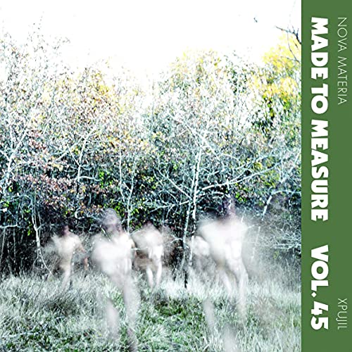 Vinyl record cover: blurred figures in a forest, green text overlay.