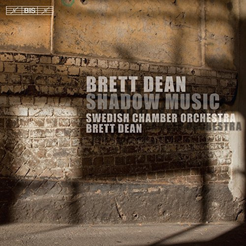 A CD cover featuring a brick wall with sunlight and shadows.