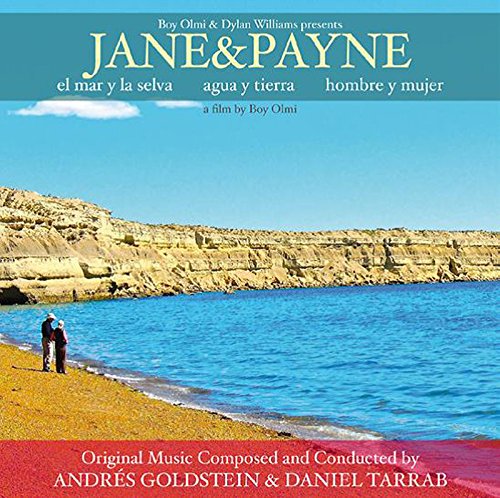 "CD cover with a man standing on a rocky shore, blue water, and cliff."