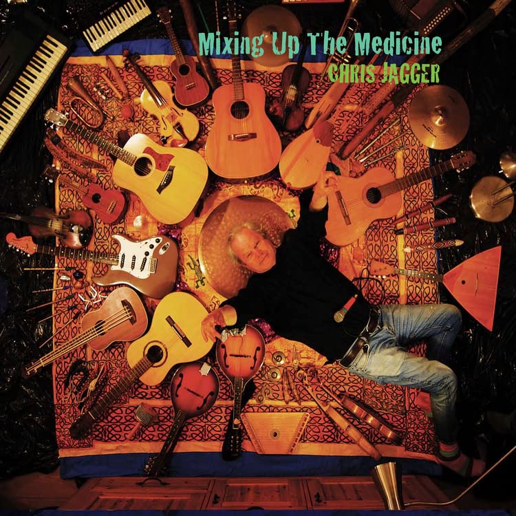 Album cover: Chris Jagger surrounded by various stringed instruments.