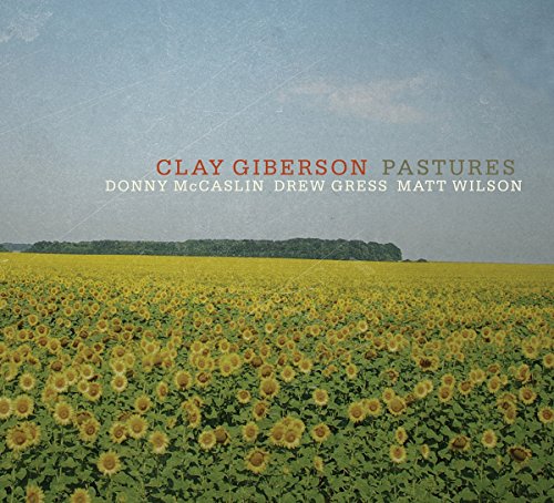 "Album cover featuring a field of sunflowers under a blue sky with text overlay."
