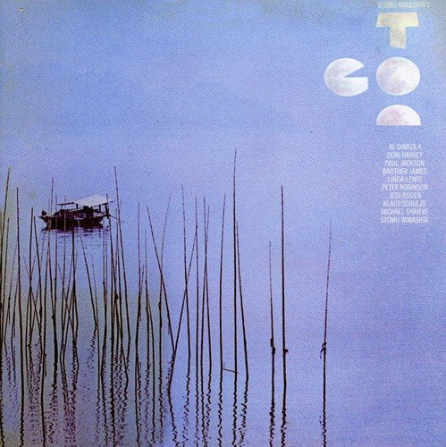 "Album cover with blue background, reeds, and a boat, featuring white text 'Go Too'."