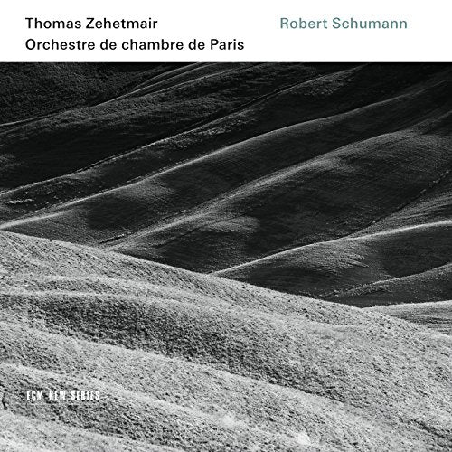 "CD cover featuring a black-and-white landscape image with artist and composer names."