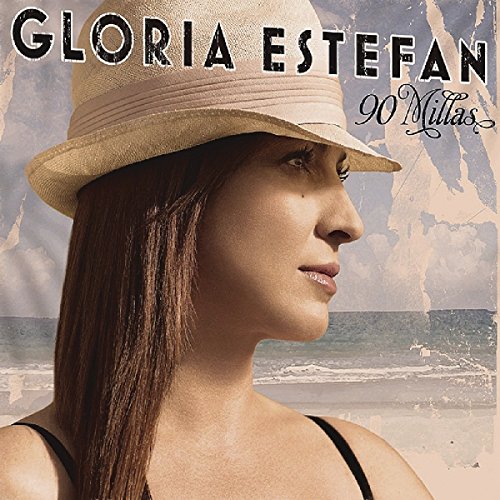 "Album cover with a woman wearing a hat, facing right, against a beach background."