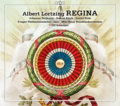 Album cover with a circular, colorful, ornate design and ribbon details.