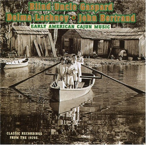 "CD cover with sepia-toned image of people in a boat near wooden shacks."