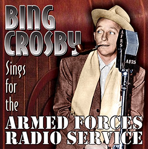 Bing Crosby wearing a hat and scarf, smoking a pipe, beside an AFRS microphone.