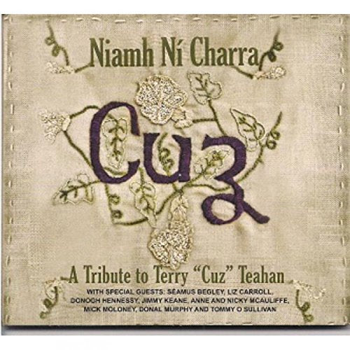 Beige fabric album cover with embroidered flowers and text in green and purple.